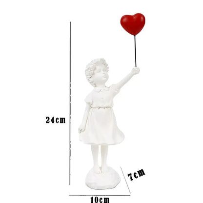 White figurine of a girl holding a red heart-shaped balloon with measurements on a white background